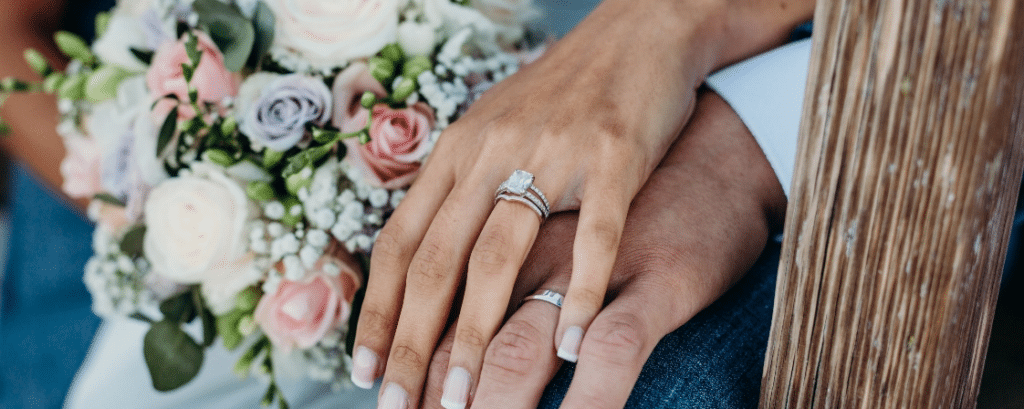 Flowers and Hands with Weddings Rings