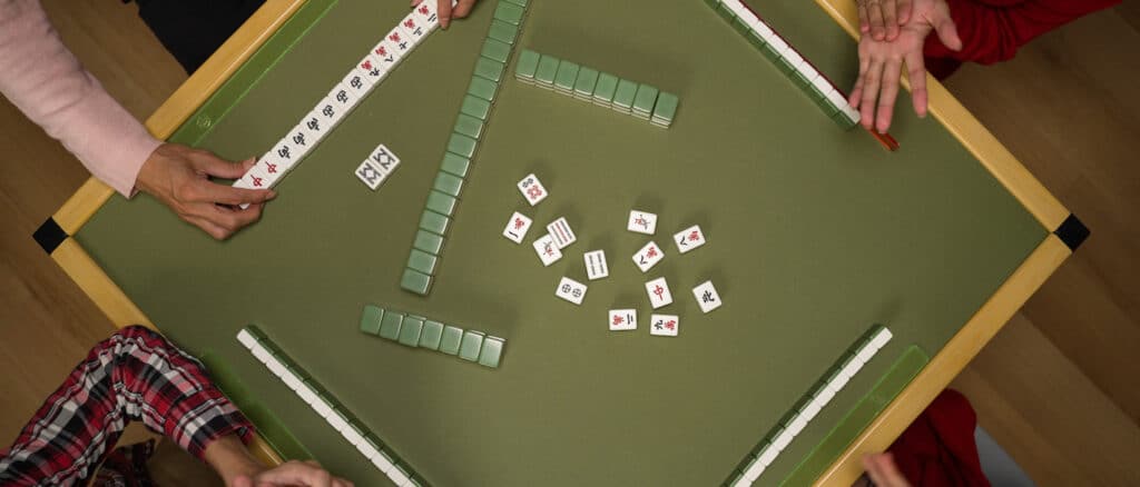 Group of People Playing Mahjong